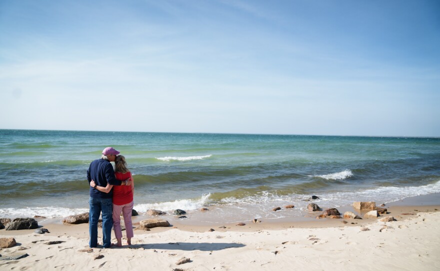 Greg and Mary Catherine walk to the beach in Brewster, Mass., where they live.
