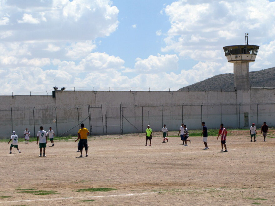 Inmates play soccer at Juarez municipal prison. Prisoners there are housed in separate wings according to their gang affiliation.