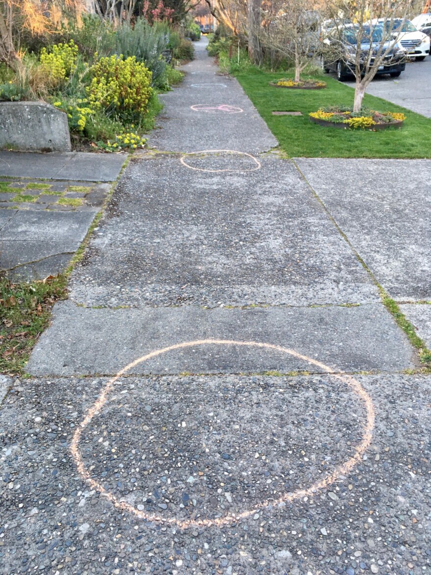 Chalk circles placed ten feet apart denote the extra-safe distance encouraged between dancers at this event. 