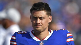 FILE - Buffalo Bills punter Matt Araiza walks on the sideline during the first half of a preseason NFL football game against the Indianapolis Colts in Orchard Park, N.Y., on Aug. 13, 2022. Araiza is being dropped from a lawsuit filed by a woman who alleged she was raped by San Diego State University football players in 2021, in an announcement Tuesday, Dec. 12, 2023. (AP Photo/Adrian Kraus, File)