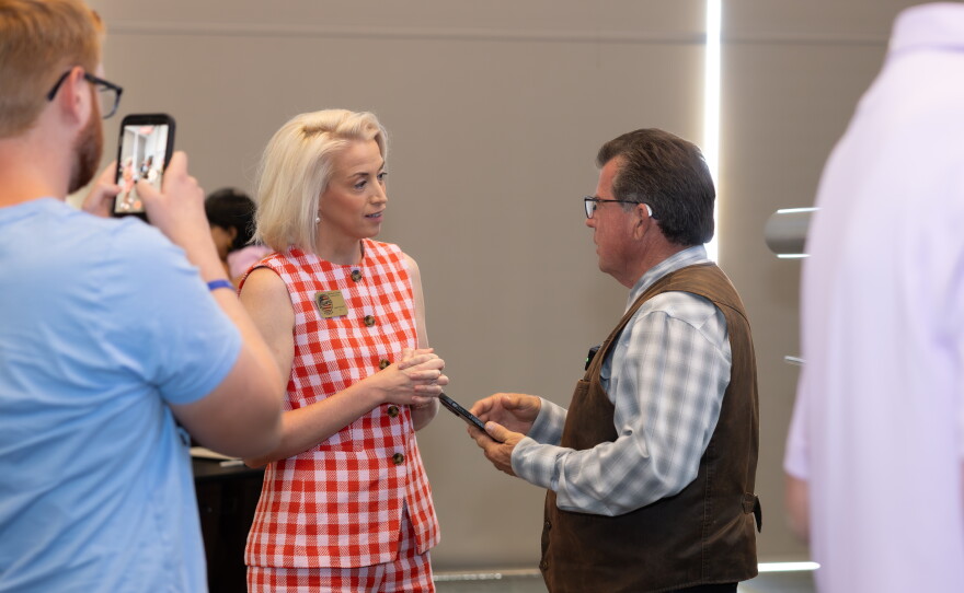 The legislators stayed behind a little while after the town hall, engaging with attendees and press.