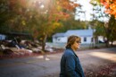 Gretchen Turner looks toward her home before making her way to Halloween festivities in downtown Waverly, Tenn.