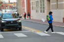 A pedestrian walks past a recently installed turn hardening lane on VCU's campus. 