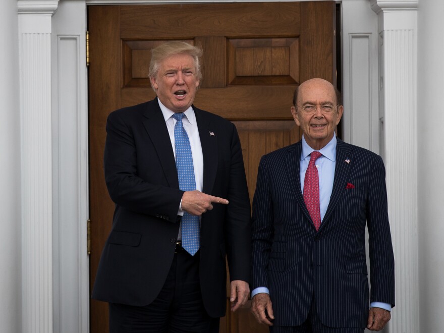 Shortly after winning the 2016 election, Donald Trump asked investor Ross to be his commerce secretary. The pair are pictured here at Trump's golf club in Bedminster, N.J., in November 2016.