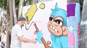 Krave working on a Fresh Monkey, aka El Mono Fresco, alongside a pole fiber bomb by fiber artist La Fibra, November 24, 2025