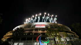 The Paralympic logo is illuminated by the flash of fireworks from the Tokyo 2020 Olympic Stadium. (Photo courtesy of Marshall Zackery)