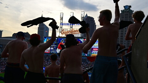 Fans participate in "tarps off" during the fifth inning of a baseball game between the Cleveland Guardians and New York Yankees, Tuesday, June 9, 2026, in Cleveland. 