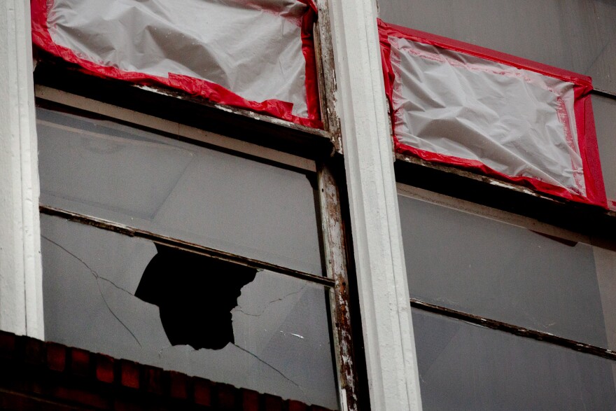 A broken window where gunfire was exchanged at Central Visual and Performing Arts High School, on Tuesday, Oct. 25, 2022, in south St. Louis.