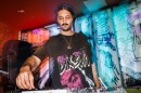 Umami, a local music producer and DJ, plays music from their mixer during a set on Saturday, July 12, 2025, at Tim’s Chrome Bar in St. Louis.