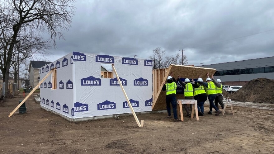 Wall raised on tiny home in groundbreaking ceremony at Hope Village