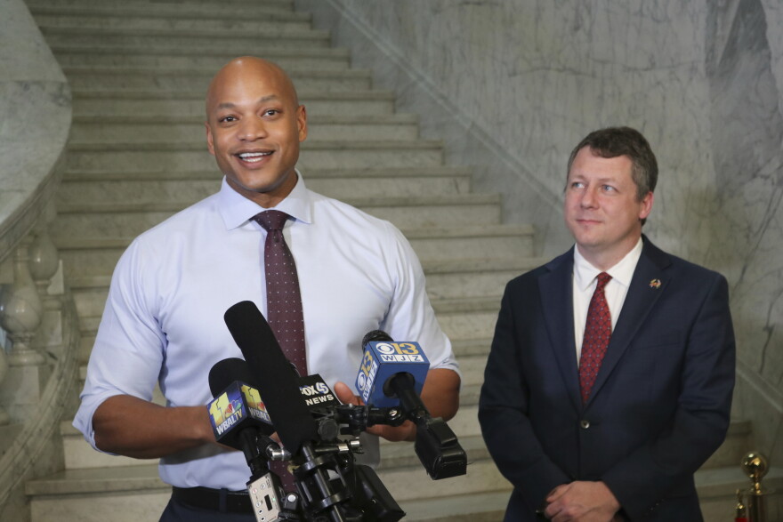 Maryland Gov. Wes Moore, left, gives an update on progress with his legislative agenda during a news conference on Monday, March 20, 2023, in Annapolis, Md. (AP Photo/Brian Witte)