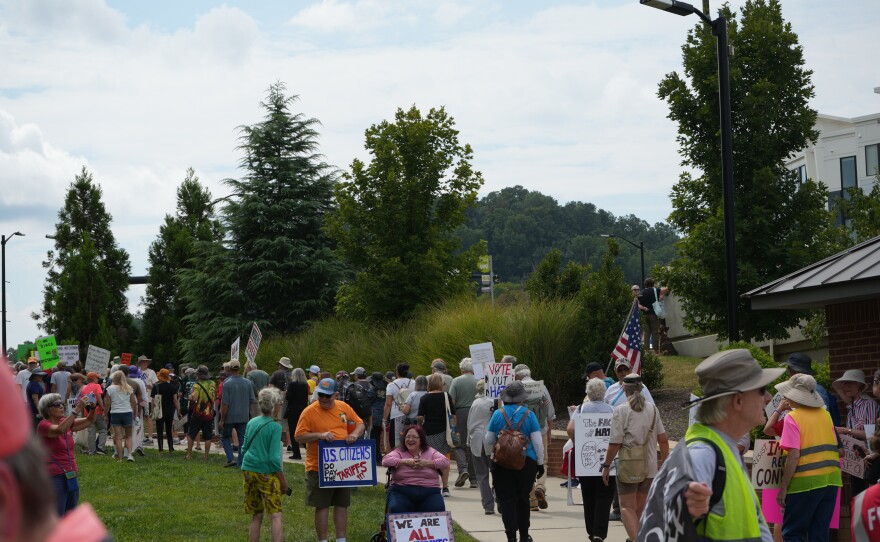 Demonstrators participate in Indivisible Knoxville’s Labor of Love protest on Henley Street Bridge in Knoxville on September 1, 2025.