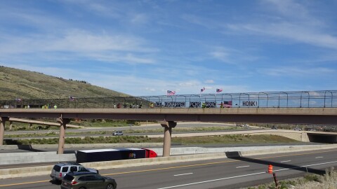 Local protest group "We Believe Visibility Bridge" took to the Interstate 80 overpass in Kimball Junction on May 2 to protest immigration enforcement activities in the Wasatch Back.