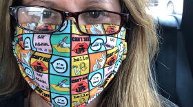 Zulma Santiago-Zayas takes a photo of herself wearing a designed facemask that has different messages across the mask that are sign language related. (Photo courtesy of Zulma Santiago-Zayas)