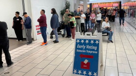 More than 100 people lined up during lunch to cast early votes at El Paso's Bassett Center on Monday, Oct. 19, the first day of early voting in the 2026 general election.