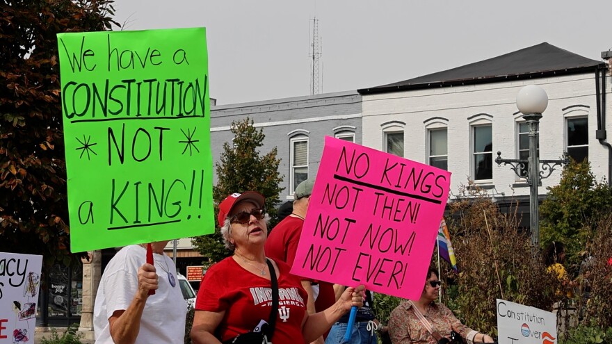 Protesters carried signs opposing the Trump administration and what they called anti-democratic actions.