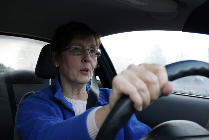 Cynthia Ulrich of Stop 405 Tolls looks unhappy as she prepares to enter the toll lane for the first time.