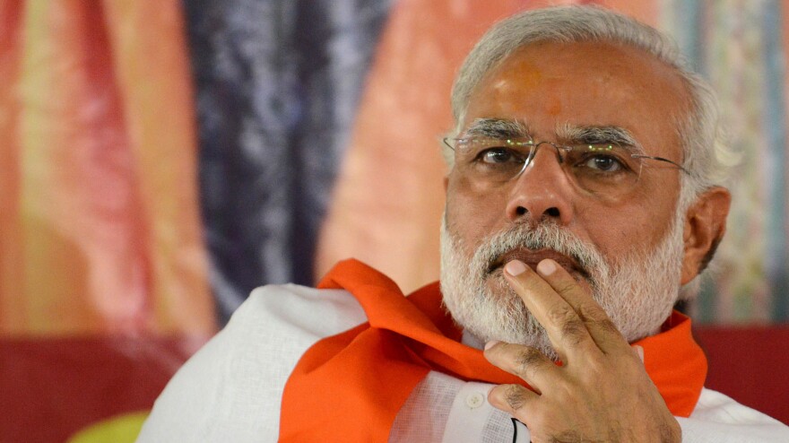 Narendra Modi, leader of the Bharatiya Janata Party, attends an April 5 rally in Gandhinagar, India. Modi, a Hindu nationalist, is seen as a strong contender to become the next prime minister, though critics say his policies would divide the country's Hindus and Muslims.