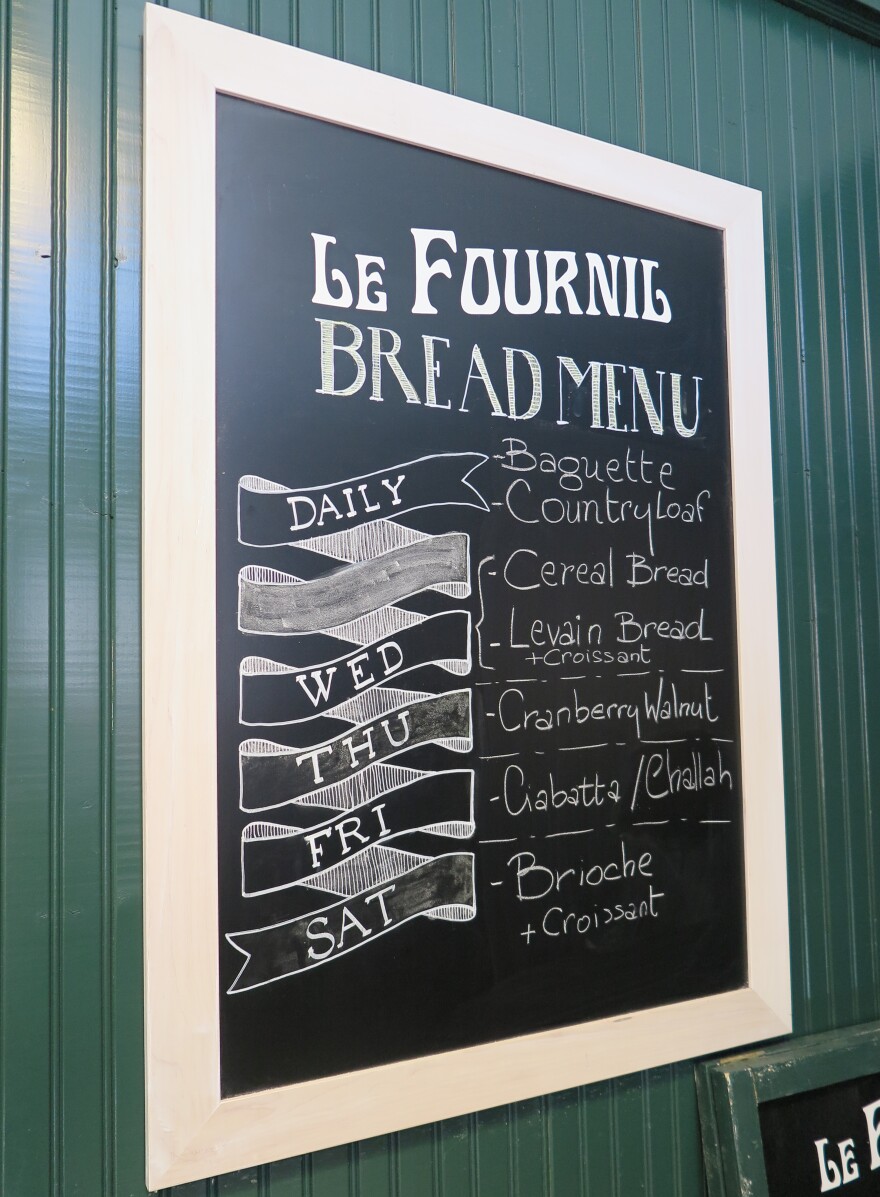 A blackboard at Le Fournil lists the bread offerings for the week, from Wednesday to Saturday when they are opened.