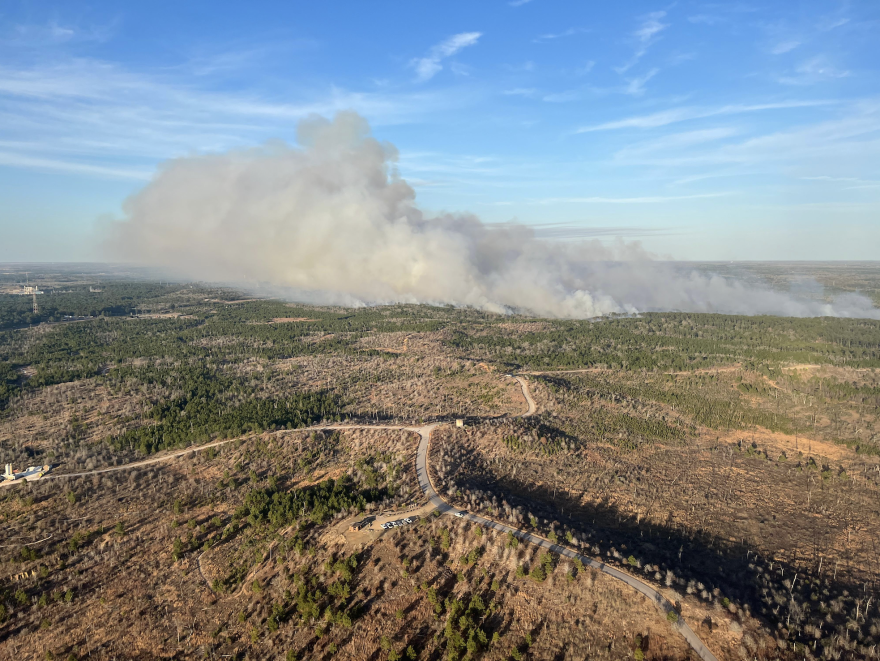 A smoke plume rises above the Rolling Pines Fire on Tuesday.