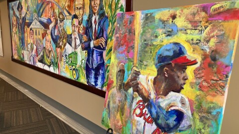 Preston Sampson's Hank Aaron painting (right, done in 2015), stands next to his permanent Quad Cities mural at Modern Woodmen Park's Diamond Club, March 26, 2026.