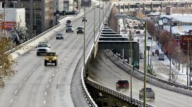 Traffic at left heads northbound on Seattle's Alaskan Way Viaduct, above the southbound lanes below, through downtown.