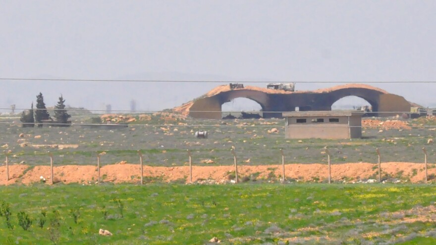 A picture taken Friday shows the damaged Shayrat airfield at the Syrian military base targeted overnight by U.S. Tomahawk cruise missiles, southeast of the central Syrian city of Homs.