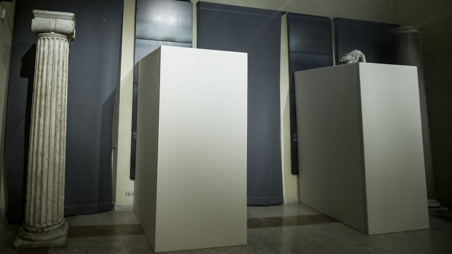 Plywood panels cover statues of naked figures Monday on the Piazza del Campidoglio in Rome, in deference to visiting Iranian President Hassan Rouhani, who met with Italian Premier Matteo Renzi.