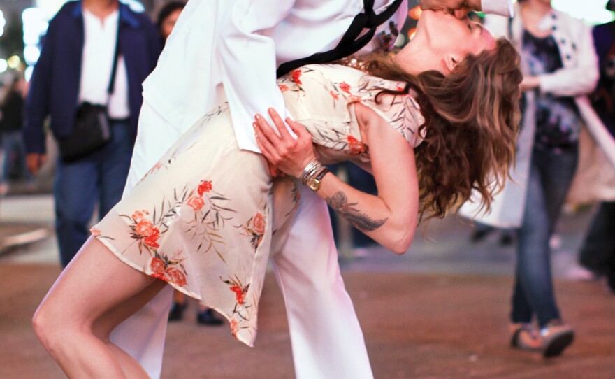 Lovers re-create an iconic kiss in Times Square.