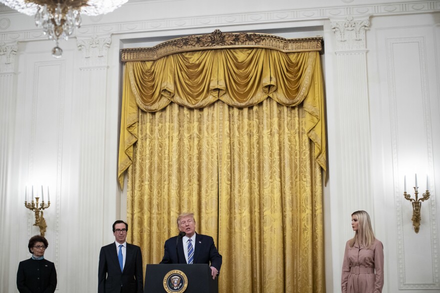 President Trump speaks as Jovita Carranza, administrator of the Small Business Administration; Treasury Secretary Steven Mnuchin; and Ivanka Trump, advisor to the president, listen during a Paycheck Protection Program event in the East Room of the White House on April 28, 2020. [Al Drago / Bloomberg via Getty Images]