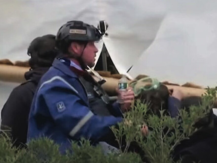 The U.S. government says in its affidavit that this photo shows Guy Reffitt outside the Capitol on Jan. 6, 2021, wearing a helmet with a camera that captured him discussing the day's insurrection.