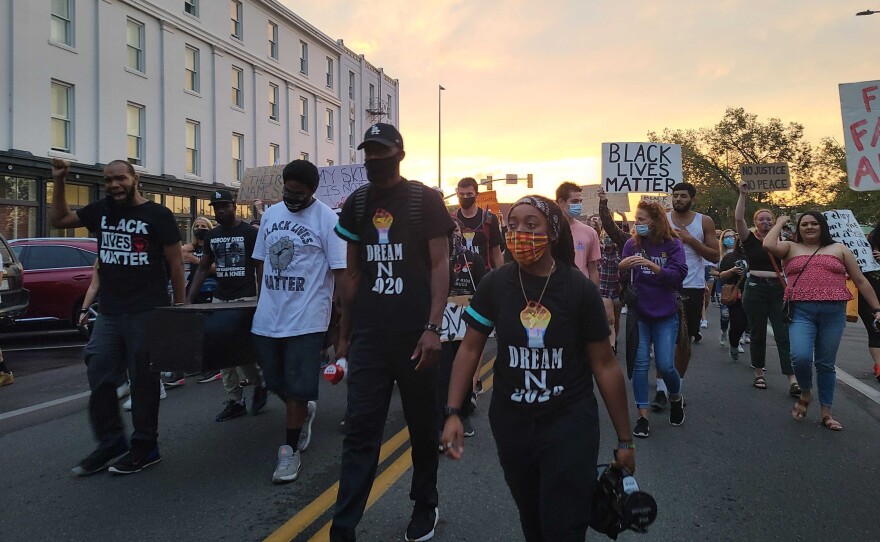 Activists march in Fort Collins on Friday, Aug. 28.