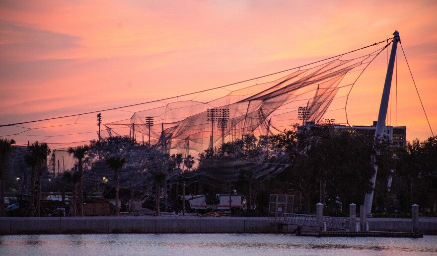 Twine sculpture against a pastel skyline