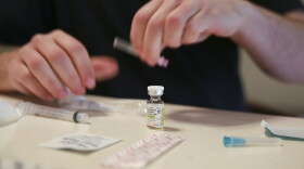 FILE - Lucas prepares his weekly testosterone shot at his home in Casselberry, Fla., May 29, 2023. The Associated Press is not using Lucas' last names because he fears reprisal.