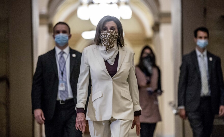 House Speaker Nancy Pelosi walks to her office after signing the Paycheck Protection Program and Health Care Enhancement Act after it passed the House on Capitol Hill on April 23.
