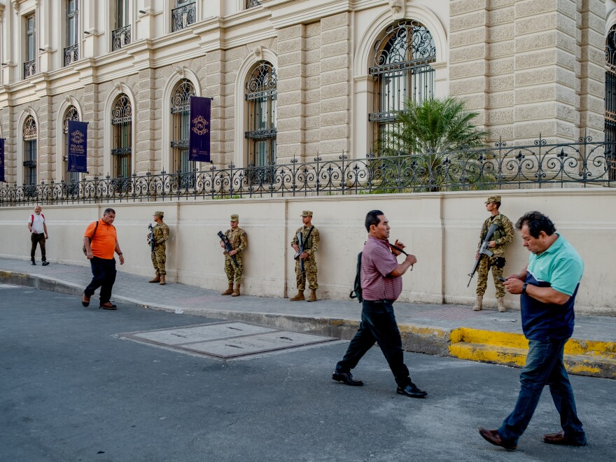 A soldier patrols downtown San Salvador on January 30, 2024. For decades, downtown San Salvador was a disputed territory between the Barrio 18 gang and MS-13.