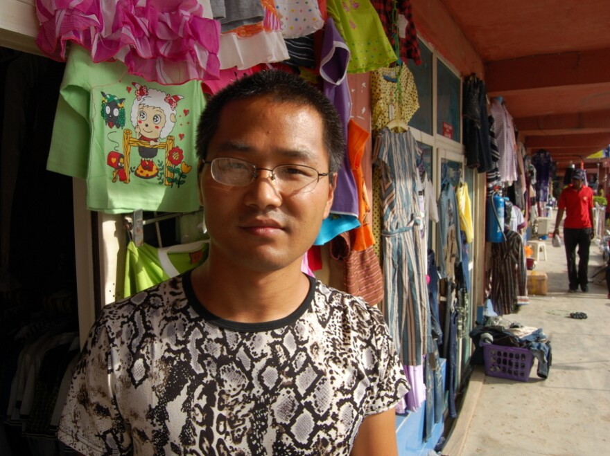 Huang Haifeng owns a shop that sells doors and men's suits. Many Nigerians see Chinese as indefatigable businessmen, but Huang says operating in Nigeria is tough.