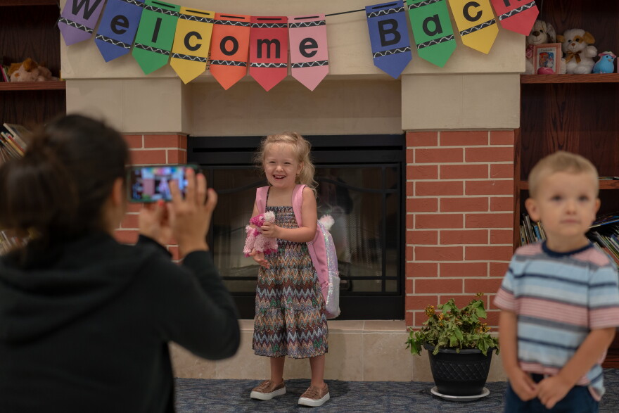 Mia Mims, 4, poses for a photo as her mother drops her off for preschool Tuesday, Aug. 13, 2019 in Affton.