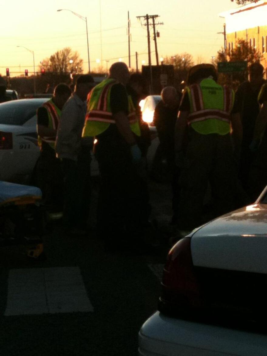 Emergency personnel tend to Yean Soo Kim following Friday's vehicle-pedestrian accident. Kim was released from the hospital a short time later.