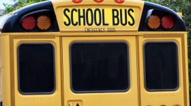 A school bus from Spiro Public Schools stands parked at the Oklahoma State University campus in Stillwater on April 15. Fifty-five rural school districts had secondary math and science teachers accept classroom positions through a signing bonus program.