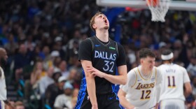 Dallas Mavericks forward Cooper Flagg (32) reacts to a score during the first half of an NBA basketball game against the Los Angeles Lakers in Dallas, Sunday, April 5, 2026.