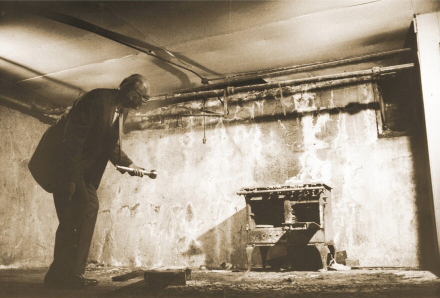 Former Oklahoma City mayor George Shirk examines an old stove in the Chinese “city” under Oklahoma City, 1969.