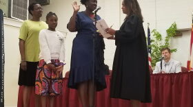 Gail Johnson took the oath of office alongside her daughter Zora, whom she called her inspiration for running for commissioner. (Matthew Arrojas/WUFT News)