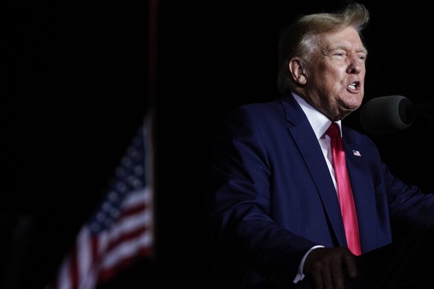 FILE - Former President Donald Trump speaks at a rally, Aug. 5, 2022, in Waukesha, Wis. Ten Republicans who posed as fake electors for former President Trump in Wisconsin and filed paperwork falsely saying he had won the battleground state have settled a civil lawsuit and admitted their actions were part of an effort to overturn President Joe Biden's victory, attorneys who filed the case announced Wednesday, Dec. 6, 2023. (AP Photo/Morry Gash, file)