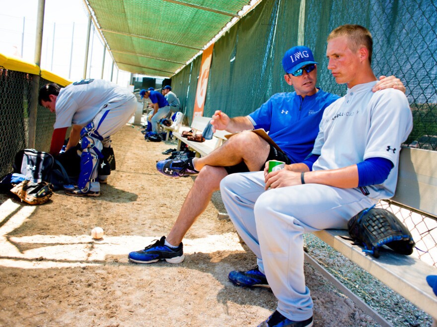 IMG Academy pitching coach Dave Shepard gives pointers to pitcher Cameron Varga.