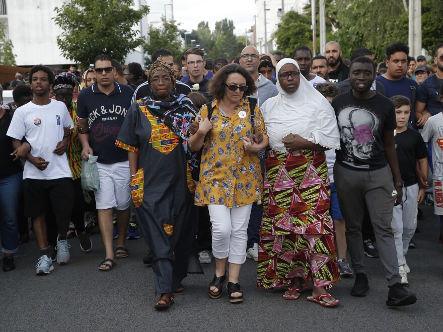 People gathered for a silent march Thursday in Nantes to protest the shooting by a police officer.