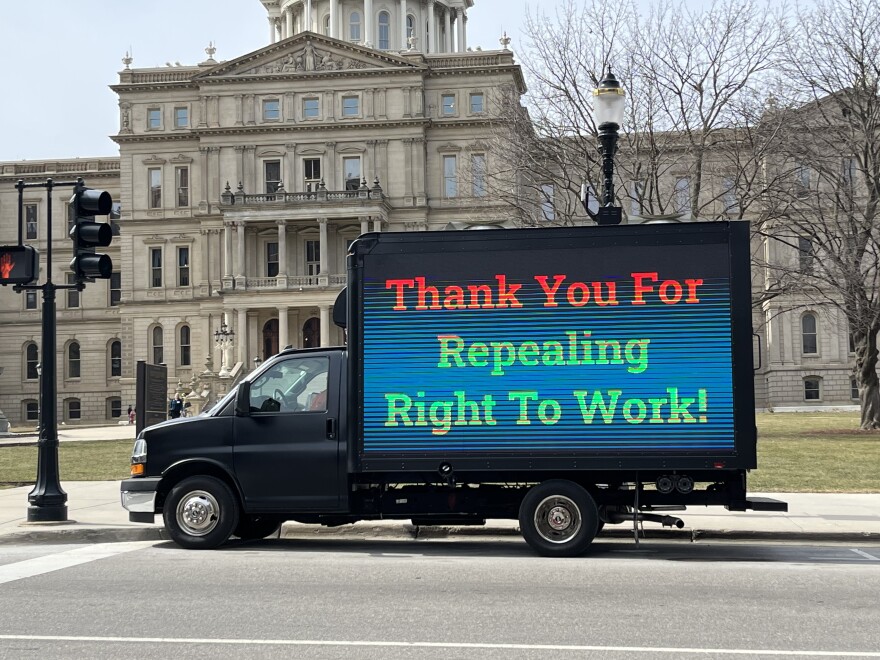 A truck parked in front of the Michigan Capitol Tuesday supports repeal of the state's right-to-work law.