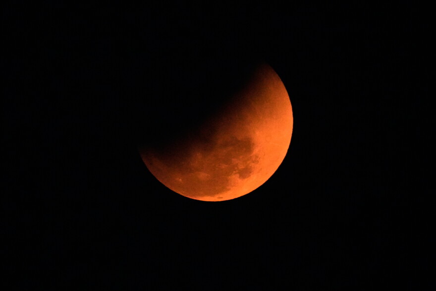 The blood moon is seen shortly after a total lunar eclipse in Guwahati, India, Tuesday, March 3, 2026. (AP Photo/Anupam Nath)