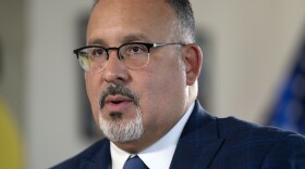 Education Secretary Miguel Cardona speaks during an interview with The Associated Press in his office at the Department of Education, Sept. 20, 2023, in Washington, D.C.