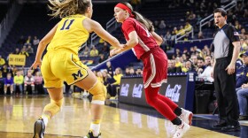 Indiana's Sara Scalia dribbles against Michigan's Greta Kampshroeder during Monday night's game in Ann Arbor, Mich.